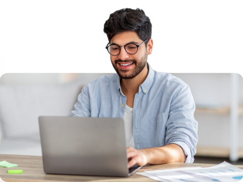 Person with glasses using a notebook